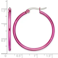 Pair of bright pink hollow tubular hoop earrings with silver-toned posts and backs, displayed against a measurement scale showing approximately 1.5 inches in length.