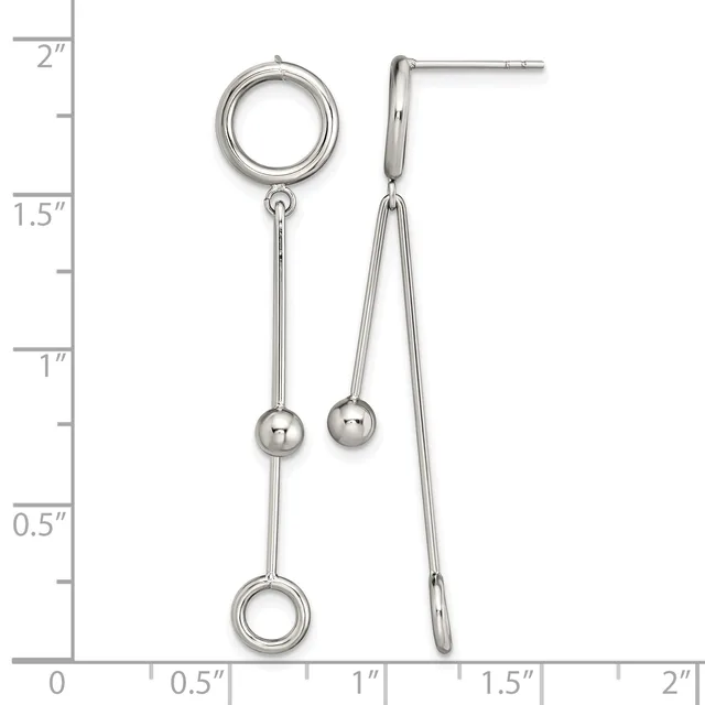 Two silver-toned earrings with circular posts at top, long chains with small spheres, and circular charms at bottom, displayed against a measurement ruler.