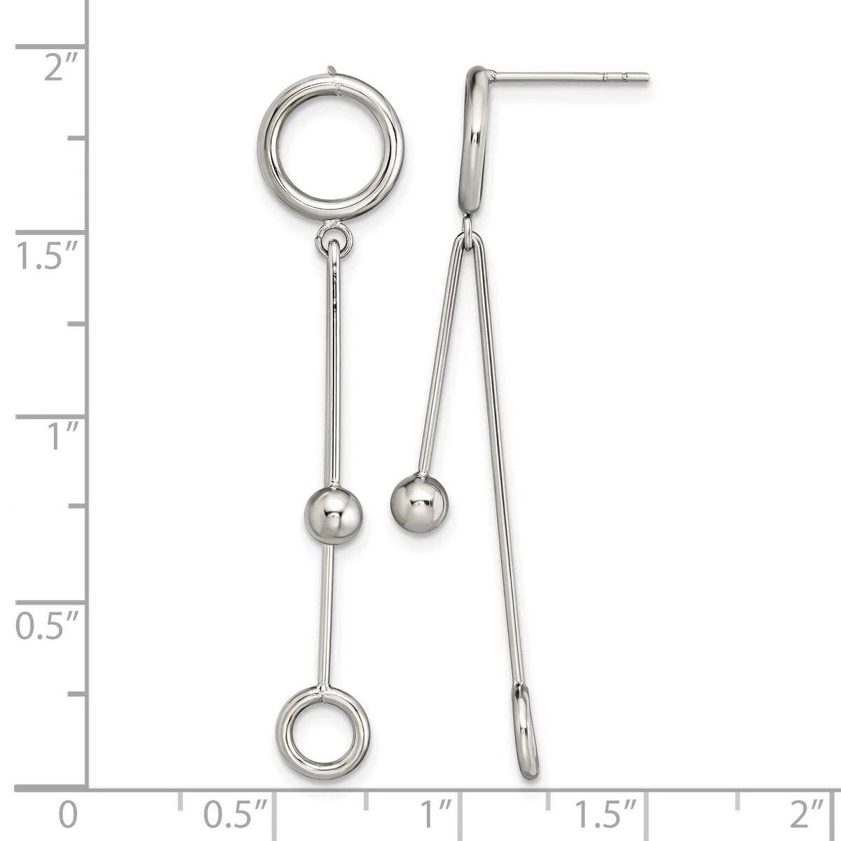 Two silver-toned earrings with circular posts at top, long chains with small spheres, and circular charms at bottom, displayed against a measurement ruler.
