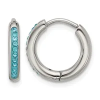 A pair of silver-toned hoop earrings, one displaying a row of turquoise crystals along its front surface, shown from the front and side.