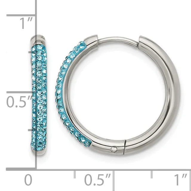 A pair of silver-tone hoop earrings with turquoise crystals embedded along the outer surface, shown with a measurement scale indicating approximately one inch in length.