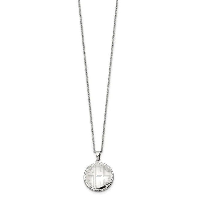 Silver-toned circular pendant necklace featuring a cross design on a round disc with beaded edge detailing, suspended from a thin chain.