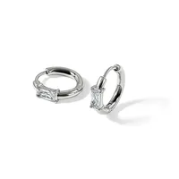 A pair of silver hoop earrings with rectangular baguette-cut crystals mounted on the front of each hoop, displayed against a white background.