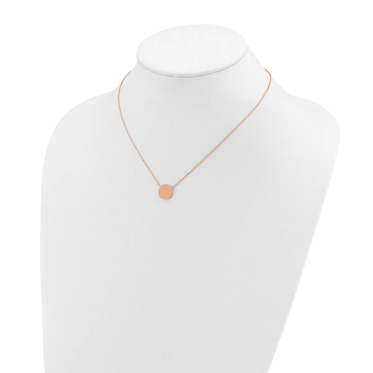 Rose gold necklace with a small round pendant displayed on a white mannequin bust.