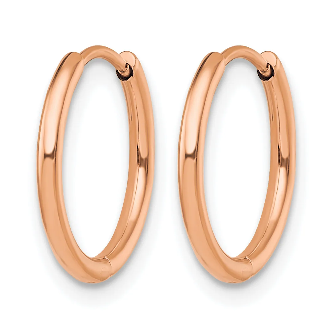 A pair of polished rose gold hoop earrings with a smooth, rounded tubular design and hinged closures.