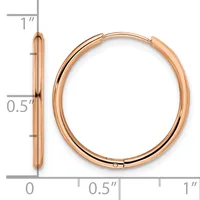 Rose gold polished hollow hoop earrings with hinged posts, shown front and side view with measurement scale indicating approximately one inch in diameter and half inch in thickness.