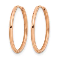 A pair of polished rose gold hoop earrings with a smooth, rounded rectangular profile and hinged closures, shown against a white background.