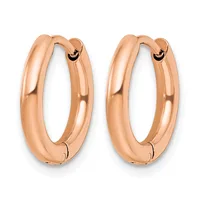 A pair of polished rose gold hoop earrings with a chunky, rounded profile and hinged closure, shown against a white background.