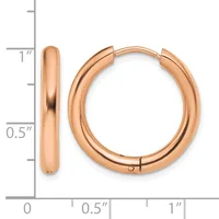 A pair of polished rose gold hoop earrings with a chunky rounded profile, shown next to a measurement scale indicating approximately one inch in diameter.