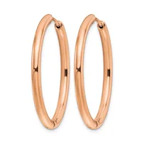 A pair of polished rose gold hoop earrings with a smooth, rounded tubular design and small hinged closures at the top.