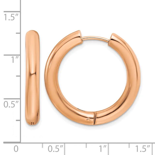 Rose gold polished chunky hoop earrings with hinged closures, displayed against a measurement scale showing approximately one inch in diameter.