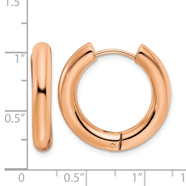 Pair of polished rose gold hoop earrings with a hinged closure, displayed next to a measurement ruler showing approximately one inch in diameter.