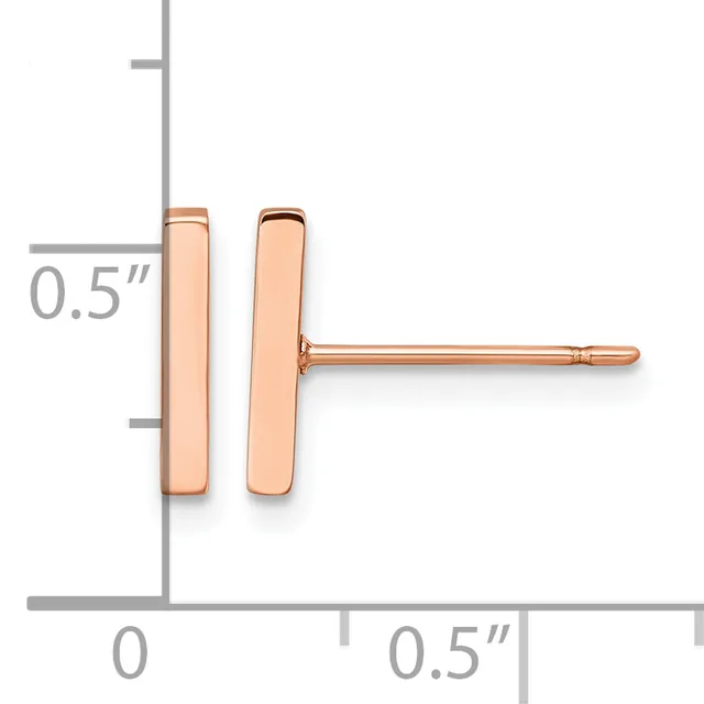 A pair of rose gold rectangular stud earrings, each approximately 0.5 inches tall, shown on a measurement scale.
