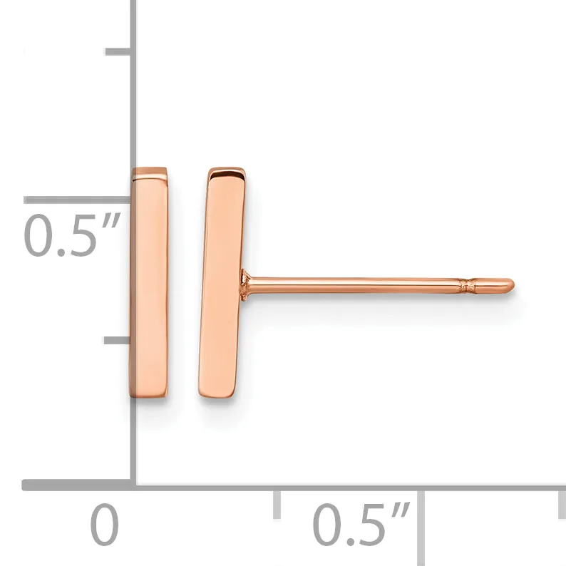 A pair of rose gold rectangular stud earrings, each approximately 0.5 inches tall, shown on a measurement scale.