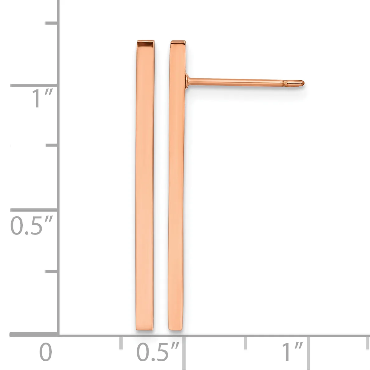Two rose gold rectangular bar stud earrings displayed next to a ruler showing approximately one inch in length.
