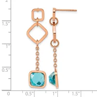 Pair of rose gold drop earrings with open square links and faceted blue topaz gemstones, displayed against a measurement scale.