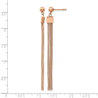 Pair of rose gold drop earrings with small ball studs and long chain tassels with square connectors, displayed on a measurement ruler.