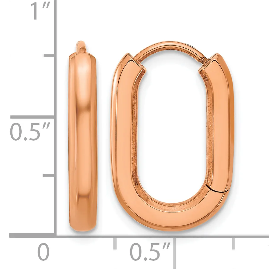 Rose gold polished oval hoop earrings with a hinged clasp, shown next to a ruler indicating approximately one inch in length and half inch in width.