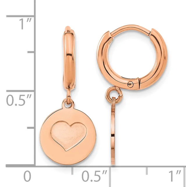 Rose gold hoop earrings with dangling circular charms featuring heart cutouts, displayed next to a measurement ruler.