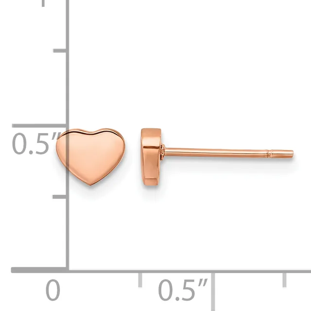 Rose gold heart-shaped stud earrings displayed next to a measurement ruler showing approximately 0.5 inches in height.