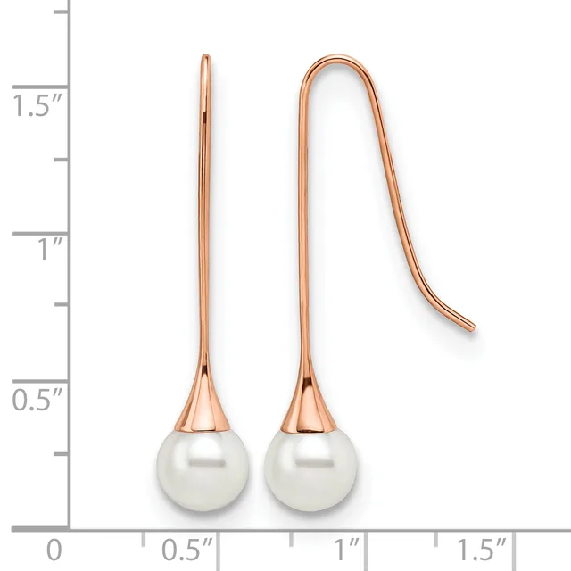 Two rose gold earrings with white pearl drops, shown next to a ruler indicating approximately 1.5 inches in length.