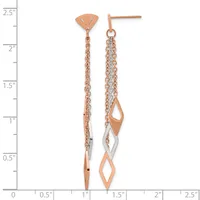 Two rose gold drop earrings with diamond-shaped cutouts and chain details, displayed against a measurement scale showing approximately two inches in length.