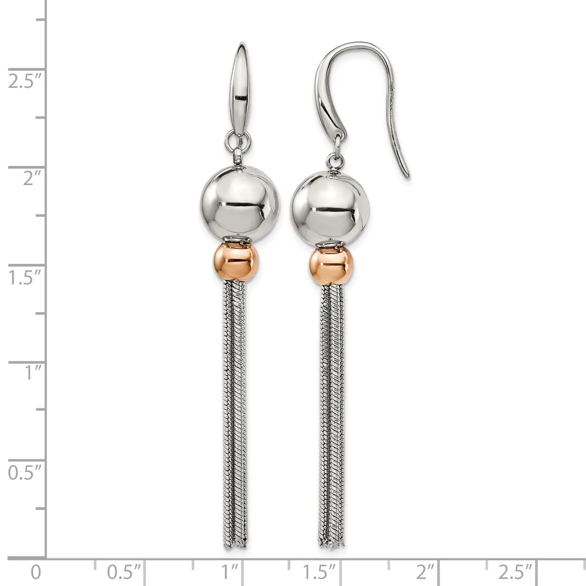 A pair of silver and rose gold dangle earrings with polished spheres and tassel chains, displayed on a measurement scale.