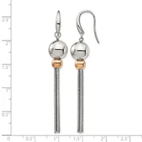A pair of silver and rose gold dangle earrings with polished spheres and tassel chains, displayed on a measurement scale.