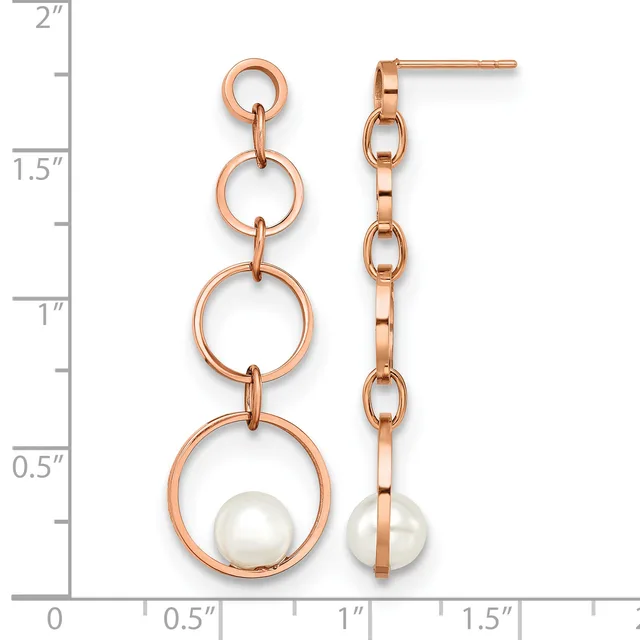 Pair of rose gold dangle earrings with three stacked circular links and a white pearl at the bottom, displayed next to a ruler showing approximately 1.75 inches in length.