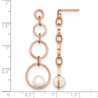 Pair of rose gold dangle earrings with three stacked circular links and a white pearl at the bottom, displayed next to a ruler showing approximately 1.75 inches in length.