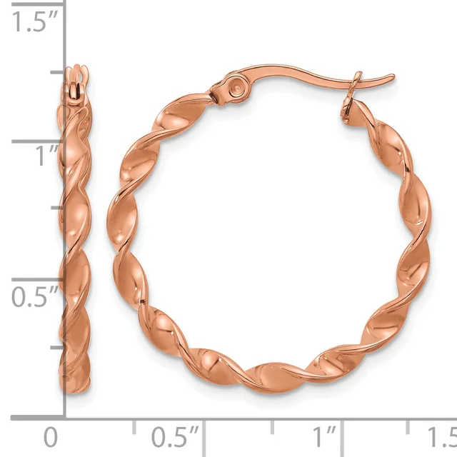 Pair of rose gold twisted hoop earrings with hinged closures, displayed next to a measurement scale showing approximately 1.25 inches in diameter.