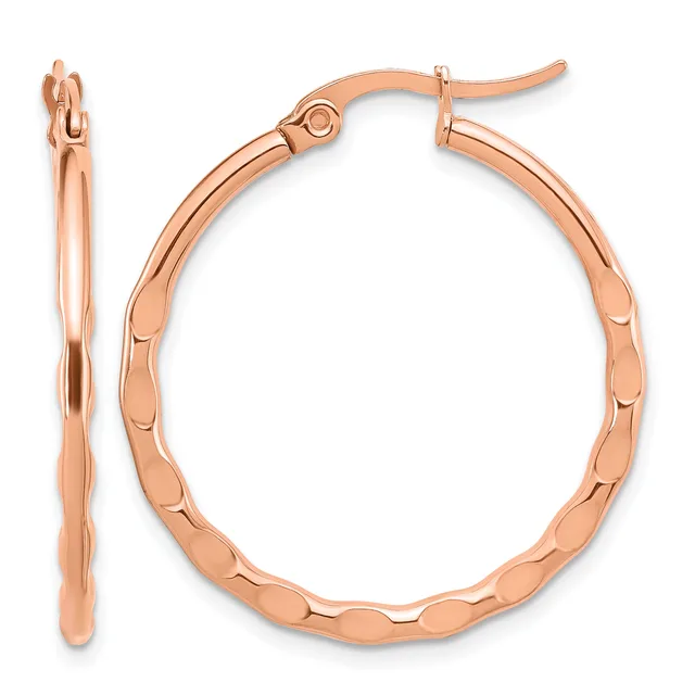 A pair of rose gold hoop earrings with a textured scalloped surface, shown from front and side views with post and clutch closures.