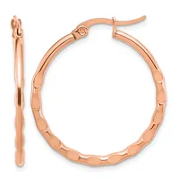 A pair of rose gold hoop earrings with a textured scalloped surface, shown from front and side views with post and clutch closures.