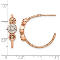 Rose gold hoop earrings with three bezel-set stones—two champagne-colored round stones flanking a center diamond—displayed against a measurement scale.