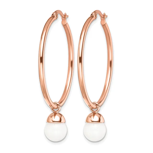 Pair of rose gold hoop earrings with white round stone or pearl charms hanging from the bottom.