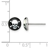 A pair of stainless steel stud earrings with black domed fronts featuring white skull and crossbones designs, shown front and side view against a ruler for scale.
