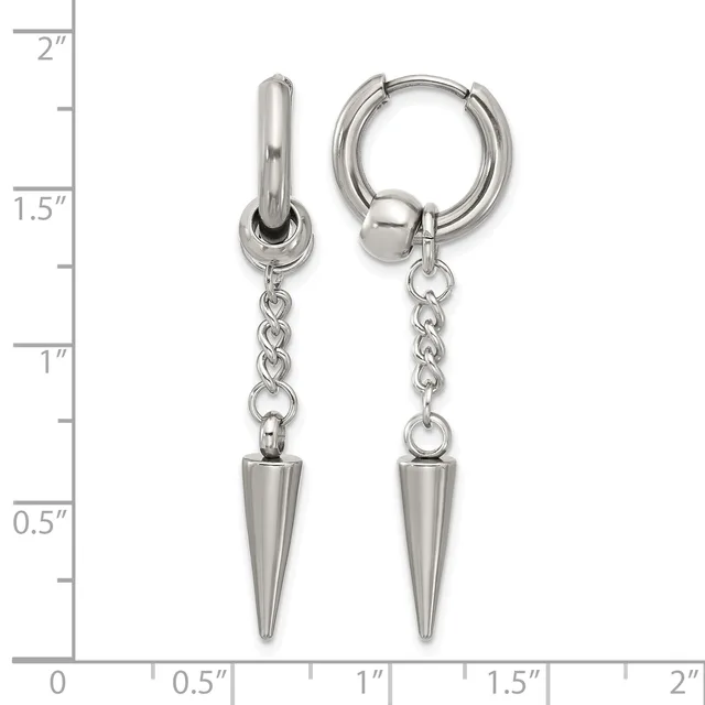 Pair of silver-toned huggie hoop earrings with dangling spike charms, shown against a ruler measuring approximately 2 inches in length.