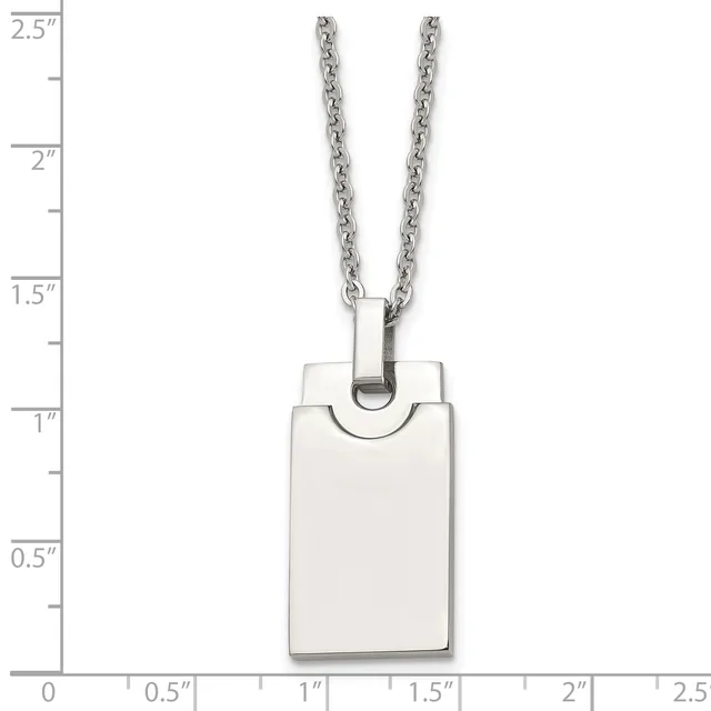 A rectangular stainless steel pendant with rounded corners hangs from a chain, displayed against a ruler showing it measures approximately one inch wide and one and a half inches tall.