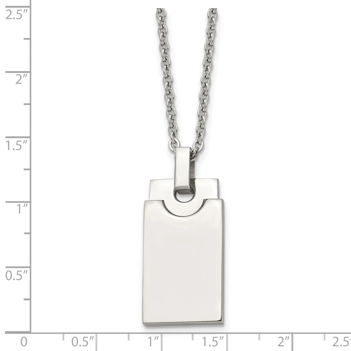 A rectangular stainless steel pendant with rounded corners hangs from a chain, displayed against a ruler showing it measures approximately one inch wide and one and a half inches tall.