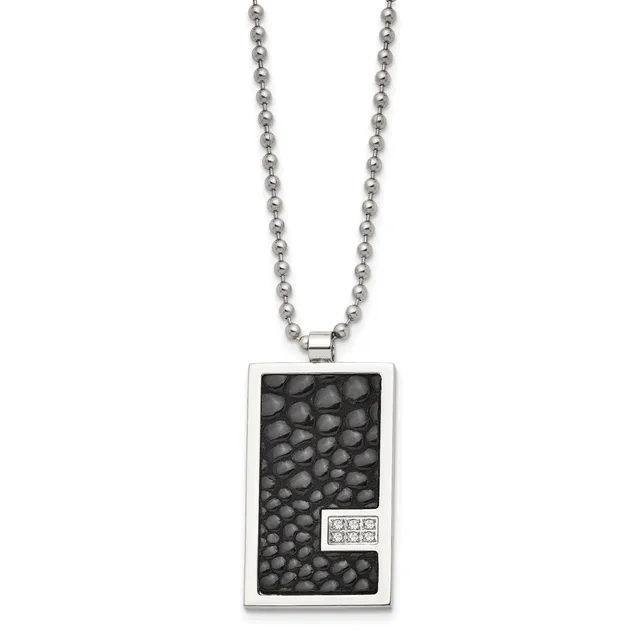 Rectangular silver pendant with textured black surface and small diamond accent, hanging from a silver ball chain.