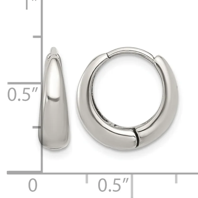 A pair of polished silver-colored chunky hoop earrings with a hinged closure, shown next to a ruler indicating they measure approximately 0.5 inches in width and depth.