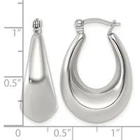 A pair of polished silver-toned chunky hoop earrings with a tapered teardrop shape, shown next to a measurement ruler indicating approximately one inch in length.