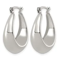 A pair of polished silver-toned chunky oval hoop earrings with a smooth, high-shine finish displayed against a white background.