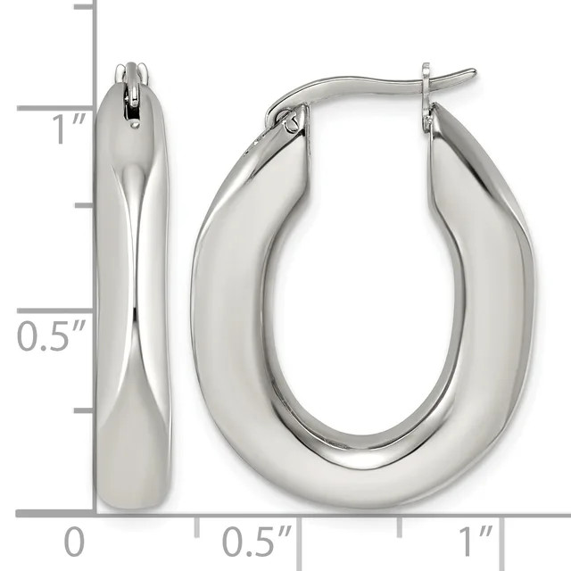 Polished silver-toned chunky oval hoop earrings shown with a measurement scale indicating approximately one inch in length and half inch in width.