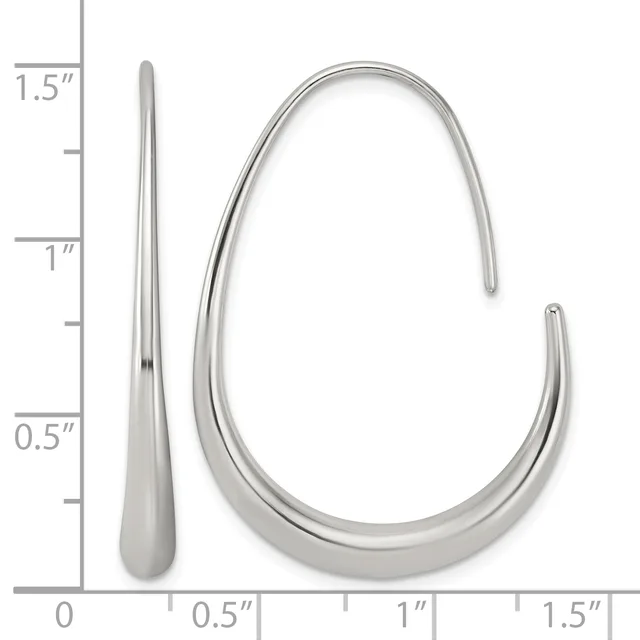 Two silver earrings displayed against a measurement grid: a long tapered drop earring and a curved tubular hoop earring with a small hallmark.