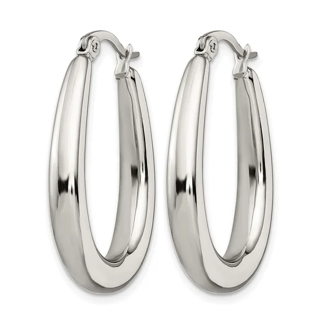 A pair of polished silver-toned oval hoop earrings with a chunky, rounded profile and hinged closures, displayed side by side.