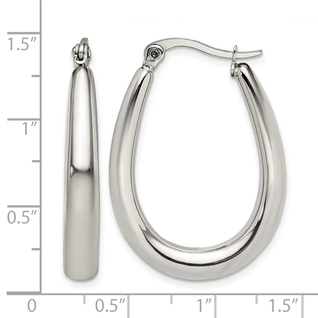 A pair of polished silver teardrop-shaped hoop earrings with hinged closures, shown next to a ruler indicating they measure approximately 1.5 inches in length.