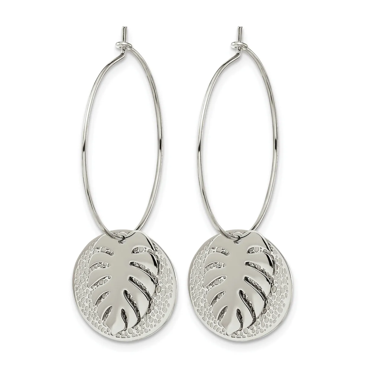 Pair of silver hoop earrings with oval loops and circular pendants featuring leaf cutout designs and textured surfaces.