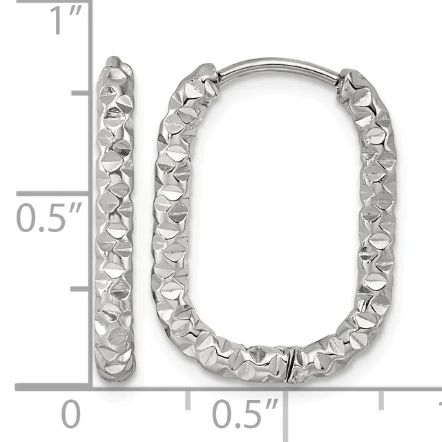 A pair of silver rectangular hoop earrings with a textured, hammered surface finish, shown next to a measurement scale indicating approximately one inch in height.