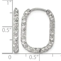 A pair of silver rectangular hoop earrings with a textured, hammered surface finish, shown next to a measurement scale indicating approximately one inch in height.